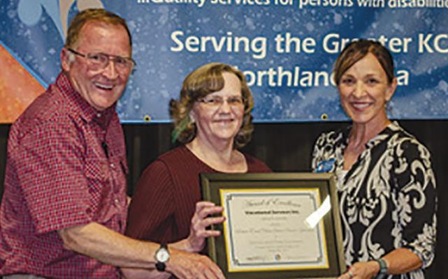 DENNIS (FROM LEFT) and Patty Summers of Excelsior Springs receive the Guardian of the Year Award from Vocational Services Incorporated Employment Manager LezLee Birdsong during the recent Community Awards and Open House event. The award was granted due to their tireless support and advocacy for their son. Submitted