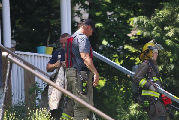 EXCELSIOR SPRINGS Firefighters Johnny Conrick (from left), Scott Guthrie and Kathryn Stewart investigate a report of a structure fire. MIRANDA JAMISON | Staff