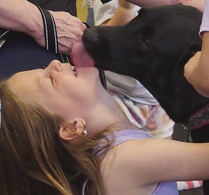K-9 Lola shares doggie love