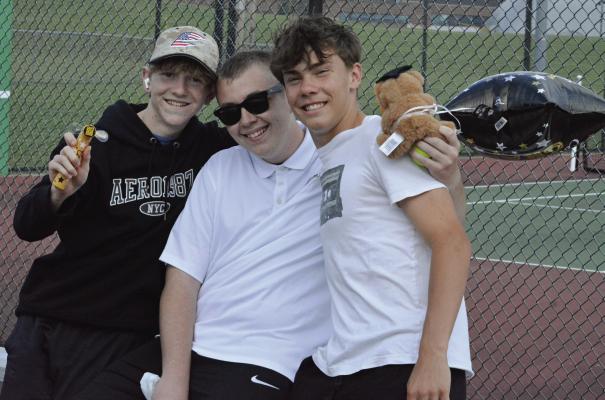 EXCELSIOR SPRINGS SENIOR Mitchell Blankenship (center) enjoys a moment of appreciation from fellow Tigers Noah Dunker (left) and Ethan Tade on Senior Night. SHAWN RONEY | Staff