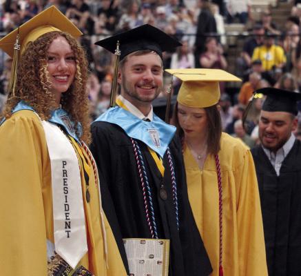 REGAN BISHOP (left) and Jameson Bright prepare for the presentation of diplomas.