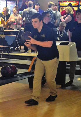 WITH BOWLING BALL in hand, Excelsior Springs sophomore Joshua Oldham eyes the pins at the end of the lane. DUSTIN DANNER | Staff