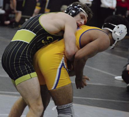 SENIOR GAIGE CARR (left) stays in control as he wrestles Larry Clayton of Center, a Kansas City-based school, during the Excelsior Springs Tiger Classic. SHAWN RONEY | Staff