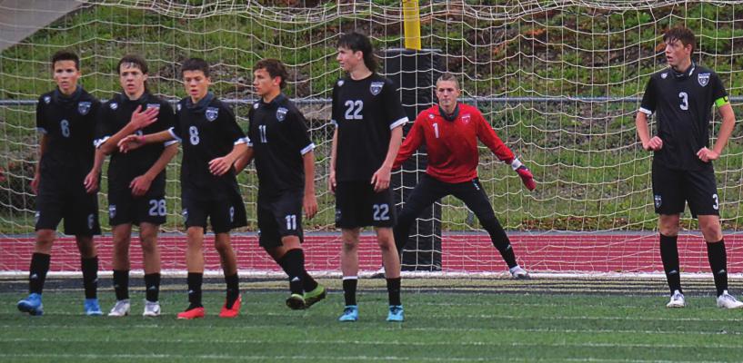 EXCELSIOR SPRINGS field players form a wall to try to help goalkeeper Braxton Moffett defend against a free kick. DUSTIN DANNER | Staff