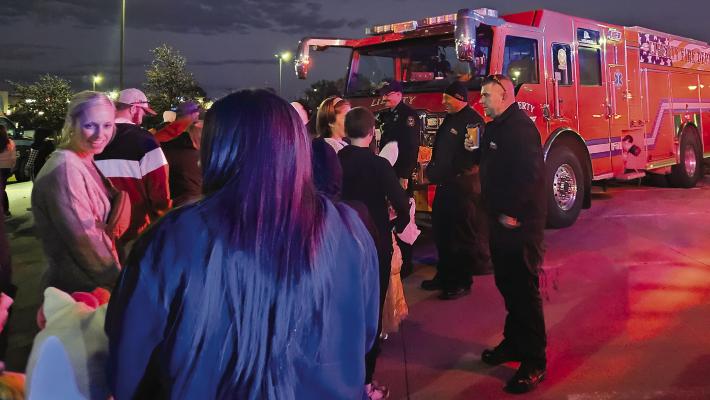 LIBERTY FIRE DEPARTMENT hands out treats to attendees. MIRANDA JAMISON | Staff