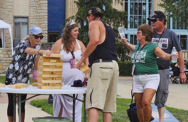 WINE FESTIVAL attendees engage in a lively game of Jenga while also exploring the various vendors at the event. See page 7 for photos. MIRANDA JAMISON | Staff