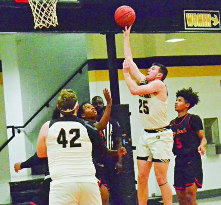 JUNIOR EASTON RYAN puts up a floater for two points during Excelsior Springs’ Feb. 9 loss to Raytown South in varsity boys basketball. DUSTIN DANNER | Staff