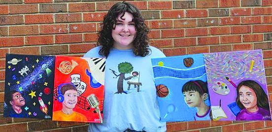 KATELIN MANSELL shows off her four paintings created for the Excelsior Springs School District Office. KATELIN MANSELL | Submitted