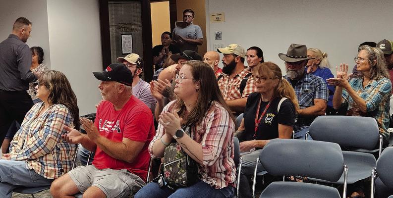 RESIDENTS FILL THE council chambers as community members voice opposition to the city’s Flock cameras. Audience members applaud following public comments calling on city council members to remove the cameras and end the city’s relationship with Flock. MIRANDA JAMISON | Staff