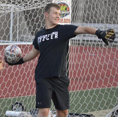 BRETT JONES drills on stopping shots and throwing outlet passes during a recent camp for Excelsior Springs soccer players. SHAWN RONEY | Staff
