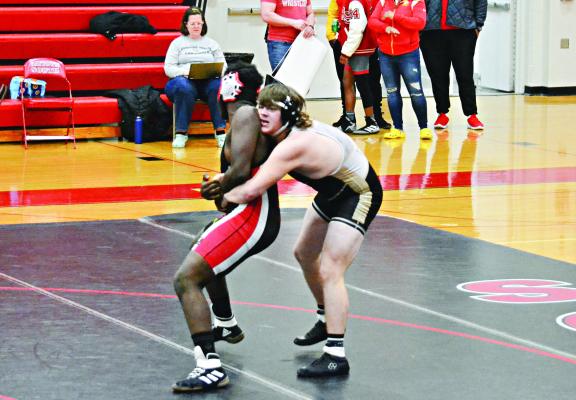 EXCELSIOR SPRINGS junior Lane Crowley, right, controls his opponent prior to scoring a takedown and getting a victory by pin during the Tigers’ 65-15 Feb. 1 road dual win over Raytown South. DUSTIN DANNER | Staff