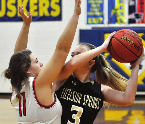 OFTEN CALLED UPON as a scorer, Excelsior Springs senior Mallory Millsap takes on the job of protecting the ball as she is closely guarded by Richmond senior Jaedyn Lopez during the first half of the fifth-place game at the Husker Classic on Dec. 10 at Lafayette County of Higginsville. SHAWN RONEY | Staff