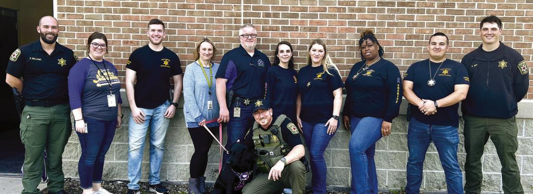 TRAINED CRISIS Intervention Team deputies of Clay County Sheriff’s Department include Deputy Dakota Williams (from left), LPC Amanda Bridges, Deputy Alex MacDonald, CIRT K9 Handler Kim Hunter, Maj. Phil Coffer, Clerk Savannah Fitzmaurice, Deputy Stephanie Atkison, Sgt. Cristina Browning, Deputy Brandon Cranmer, Deputy Brandon Smith, K9 Lola and Lt. Scott Archer (front). Submitted