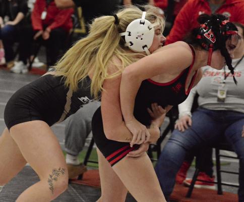 LILLAH SHUE (left) has control of Richmond’s Abigail Smith at the Excelsior Springs High School Girls Tournament. SHAWN RONEY | Staff