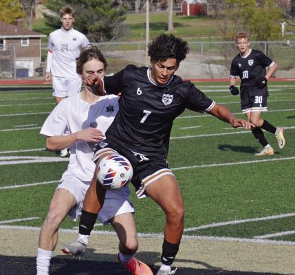 JAKE ZAPATA (No. 7) fights for possession during Excelsior Springs’ Class 2 state quarterfinal clash with St. Michael the Archangel. DUSTIN DANNER | Staff
