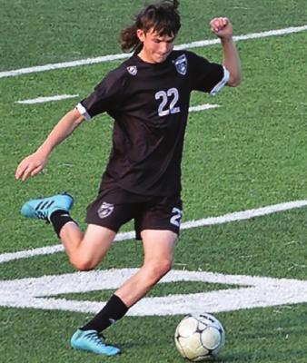 SENIOR MATTHEW SMITH boots the soccer ball downfield for the Tigers against Cameron. DUSTIN DANNER | Staff