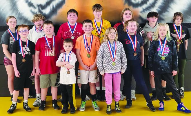 MEMBERS OF the Excelsior Springs Youth Wrestling Club proudly display their district medals. SHARON DONAT | Staff