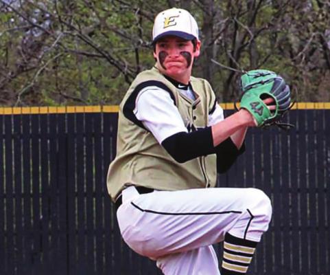 SOPHOMORE LUCAS DILLMAN goes into his windup April 6 during Excelsior Springs’ meeting with visiting Oak Grove. Dillman goes the distance and gets run support, as the Tigers explode for a 15-run second inning to claim an 18-3 victory. DUSTIN DANNER | Staff