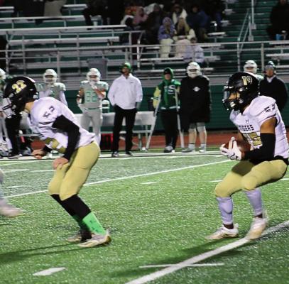 EXCELSIOR SPRINGS senior kick returner Dacey Hall, No. 19, breaks down and looks for a hole to run through during the Tigers’ 52-10 Nov. 12 road loss to Smithville in the Class 4 District 8 title game. DUSTIN DANNER | Staff