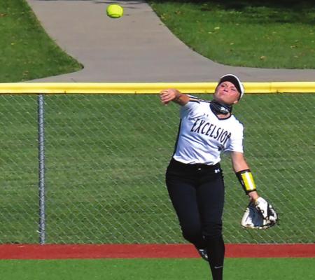 MALLORY MILLSAP, now a senior at Excelsior Springs High School, fires the ball into the infield in an attempt to throw out a runner at home during her junior softball season.