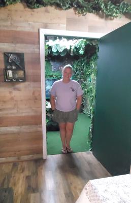 JE-ANNE RUECKERT stands inside her Jungle Room at Inside Out Escape Room at the Crown Hill Shopping Center.