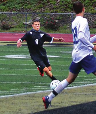 MASON WARTNER, seen here dribbling in 2020 for Excelsior Springs, has set lofty athletic goals for himself, and his school and club teams. DUSTIN DANNER | Staff