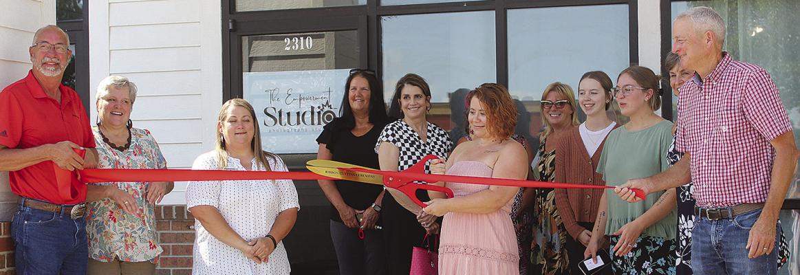 COMMUNITY MEMBERS gather for a ribbon-cutting to celebrate the opening of The Empowerment Studio. MIRANDA JAMISON | Staff