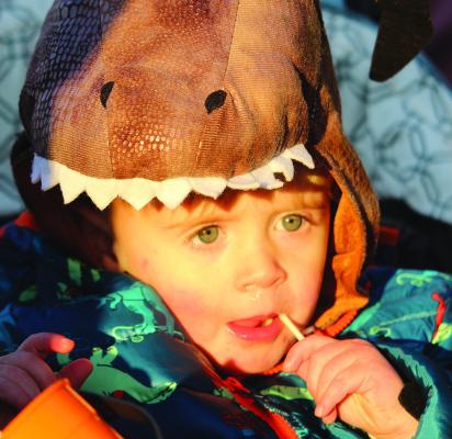 MIRANDA JAMISON | Staff WESLEY CLEVENGER enjoys a sucker during the Excelsior Springs Community Center Fall Fest.