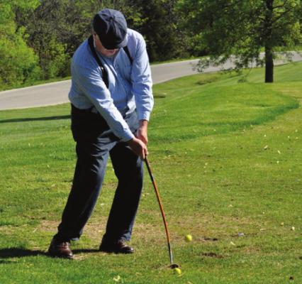 DAVE GAMET of Kansas City practices on the driving range before the Hickory Stick Golf Tournament begins May 1 at Excelsior Springs Golf Course. SHAWN RONEY | Staff