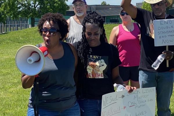 KATINA GILL appeals for an end to divisions caused by race. BRIAN RICE | Staff