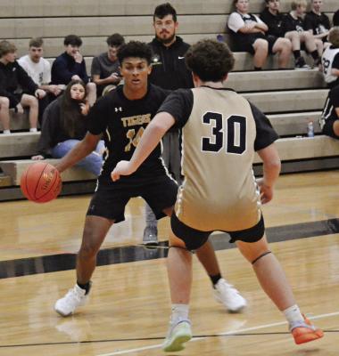 EXCELSIOR SPRINGS junior Marquez McCant, shown dribbling, is expected to help produce in the backcourt this season. DUSTIN DANNER | Staff