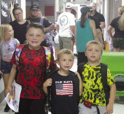 IZZAN (FROM LEFT), ISSAC and Ivvan Weber walk down the halls at the Early Childhood Center to find their classrooms for the new school year. MIRANDA JAMISON | Staff