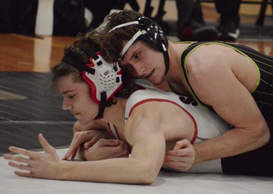GAIGE CARR (right) maintains control during his wrestling match with Julius Vajda. Carr helped the Excelsior Springs varsity boys cruise to a 59-6 dual victory over Raytown South. Excelsior Springs wrestling coverage continues on page 16. SHAWN RONEY | Staff