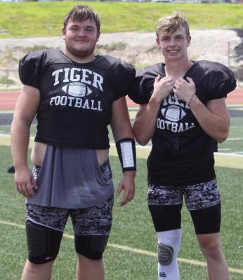 JUSTIN WRIGHT (left) and Dawson Claypole, shown after a summer camp session, have received postseason football honors, along with fellow senior Carson Gholson. MIRANDA JAMISON | Staff