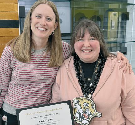 LEWIS ELEMENTARY Principal Dr. Jill Comstock (left) recognizes Library Assistant Sarah Frost after receiving the district’s Classified Employee of the Month Award. Submitted