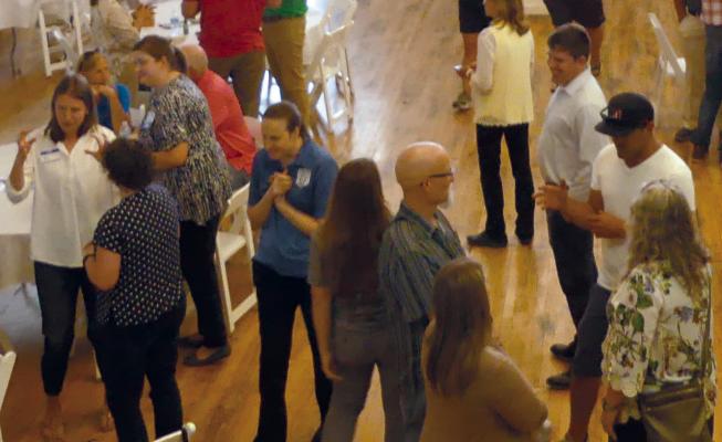CHAMBER MEMBERS visit among themselves at recent chamber luncheon. ELIZABETH BARNT | Staff
