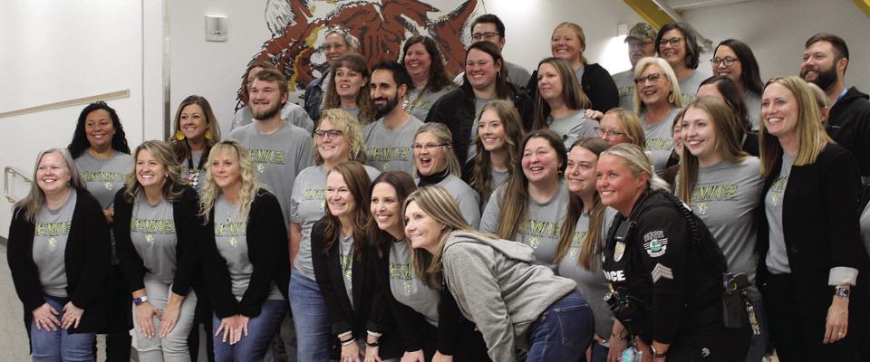 THE TEACHERS and staff at Lewis Elementary share their excitement about the new building. Photos by SHARON DONAT