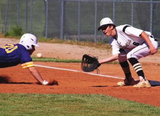 SOPHOMORE FIRST BASEMAN Colson Moore receives a pickoff throw during Excelsior Springs’ regular-season finale May 13 against visiting Belton. DUSTIN DANNER | Staff