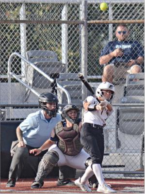 EXCELSIOR SPRINGS senior Bailey Carder lofts the ball into the air as she pulls it down the line during the Tigers’ Sept. 19 home victory over Oak Park, a Kansas City-based school. DUSTIN DANNER | Staff