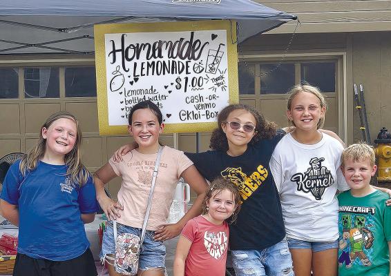 EMMALYN BRAILE (from left), Amiah Williams, Adeline Bailey, Addison Frese, Madeline Colvin and Forest Bailey withstand the heat as they come together to organize and operate a delightful lemonade stand. MIRANDA JAMISON | Staff