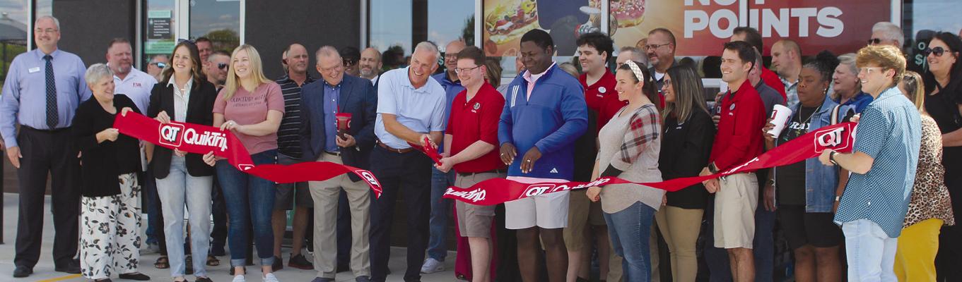 QUIKTRIP CUTS the ribbon, signifying their opening in Excelsior Springs. “I’ve always heard people talking about wanting to have a QuikTrip in Excelsior Springs,” said QuikTrip District Manager Matthew Branch. “I’ve had the honor of opening quite a few stores, but I haven’t seen a community be quite as excited as the good folks here in Excelsior Springs are.” SHARON DONAT | Staff