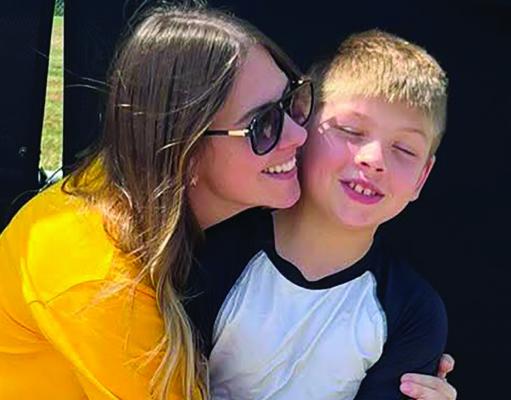 ASHLEY JEHNZEN wishes her nephew, Daxton Shipman, good luck before his first fifth-grade ESFA game of the season. The Tigers won 26-0. Submitted