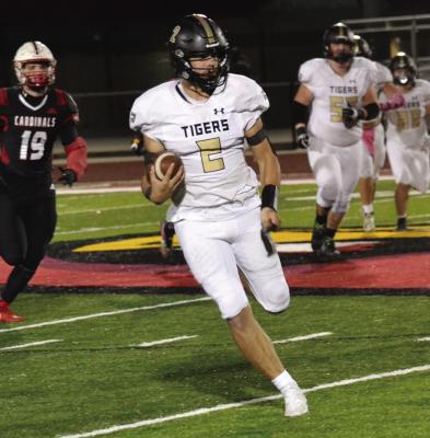 EXCELSIOR SPRINGS senior quarterback Chance Moreland races from the middle of the field toward the sideline during the Tigers’ Oct. 14 road win over Raytown South. Moreland finishes the 34-27 Greater Kansas City Suburban Conference-Blue Division victory with 217 yards rushing and four touchdowns. DUSTIN DANNER | Staff