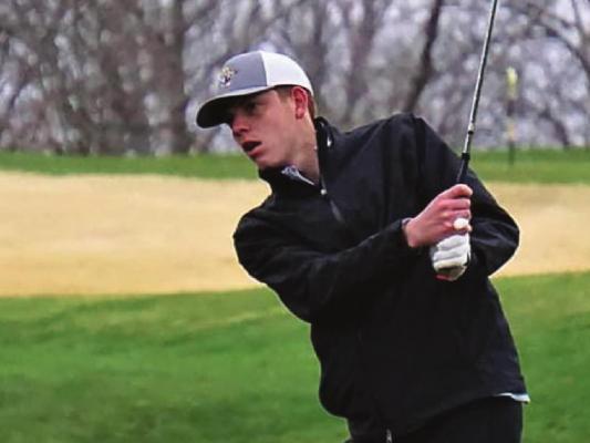 EXCELSIOR SPRINGS senior Ethan Edwards chips onto the green last week in a home triangular with Pleasant Hill and Oak Grove. DUSTIN DANNER | Staff