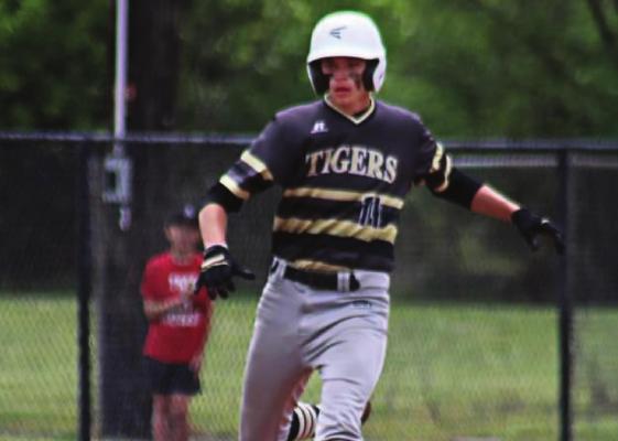 EXCELSIOR SPRINGS junior Seth Barton, between third base and home, looks down the line May 8 at The 3&amp;2 Baseball Club in Kansas City, where the Tigers play Pembroke Hill and Willard in a triangular. DUSTIN DANNER | Staff