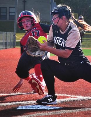 EXCELSIOR SPRINGS sophomore pitcher Bailey Carder attempts to make a play at the plate during the Tigers’ 10-9 win over Odessa on Oct. 2 in the Excelsior Springs Tournament. DUSTIN DANNER | Staff
