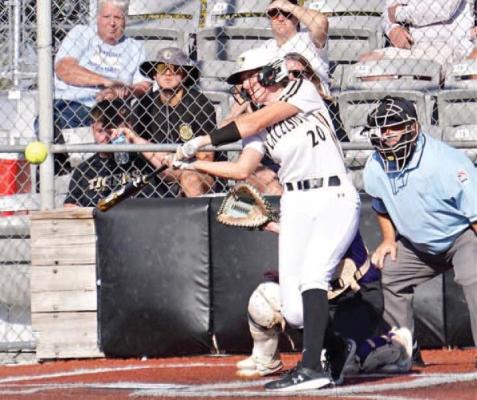 KINLEY ROGERS keeps her eyes on the softball and swings during a recent plate appearance for Excelsior Springs.