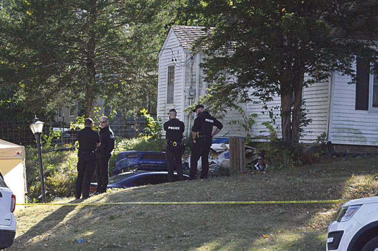 EXCELSIOR SPRINGS POLICE DEPARTMENT officers are at the home of suspect Timothy Haslett Jr. as the investigation into the alleged kidnapping, rape and assault charges continue. A yellow tent, left, is set up for evidence. TARA ALTIS | Staff