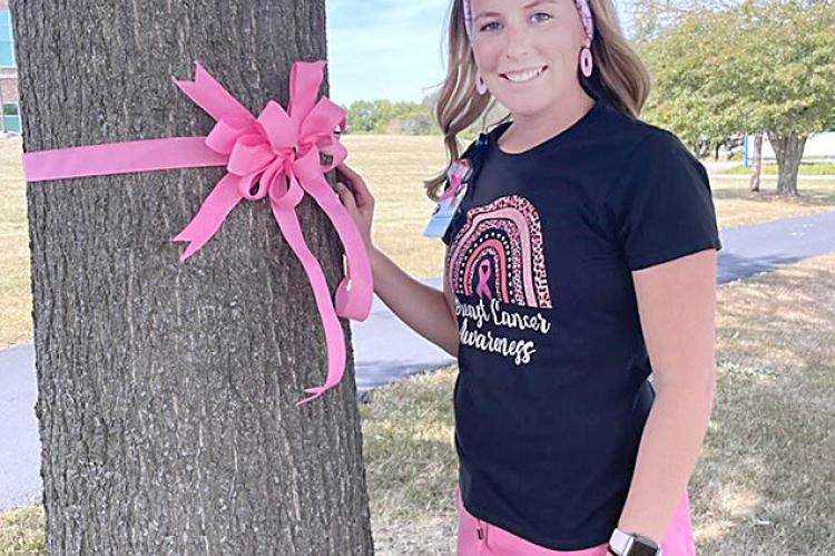 THE EXCELSIOR SPRINGS HOSPITAL campus has been decorated with pink ribbons to remind everyone of Breast Cancer Awareness Month and to remember those who have lost their lives to breast cancer. Courtney Jones, a radiology technician at the hospital, is dressed in pink as a reminder to patients about the month. TARA ALTIS | Staff