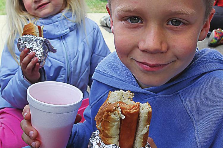 IN ADDITION to eggs and prizes, Dakota Davis, 4; and brother William Davis, 7, join in having free hotdogs and drinks.